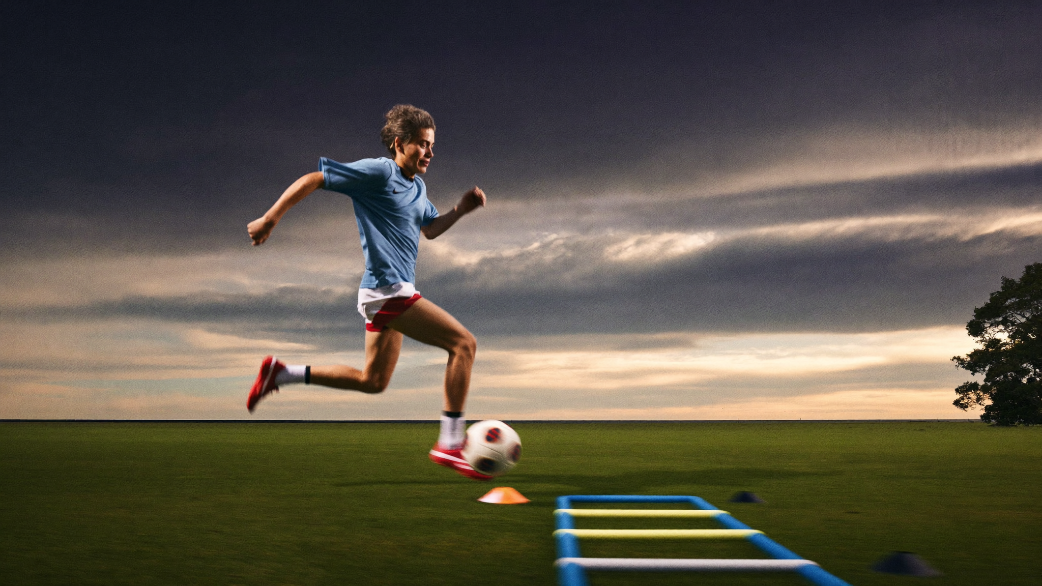 Competitive young soccer player sprinting an agility course during advanced training in Charleston