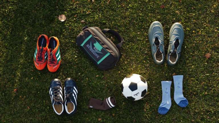 Youth soccer gear laid out on grass ahead of fall season in Charleston